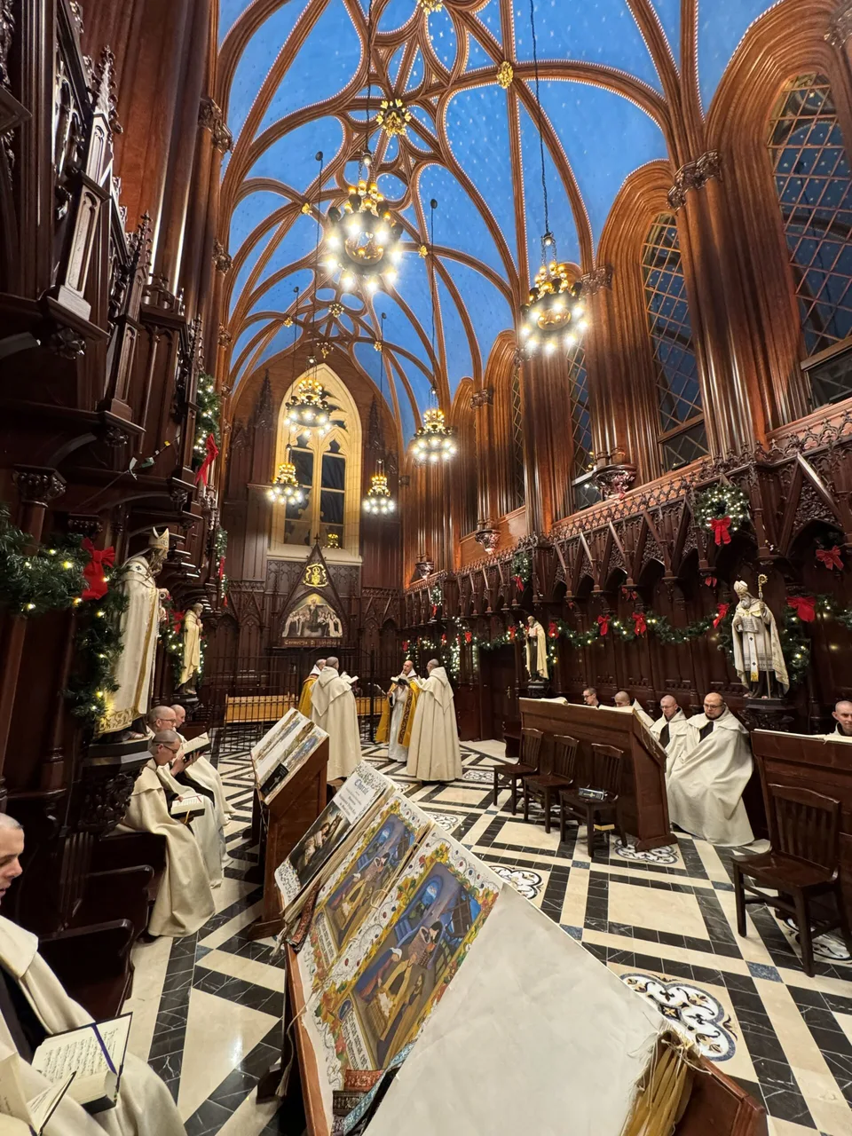 Monks chanting the Divine Office in the Chapter House at Christmas