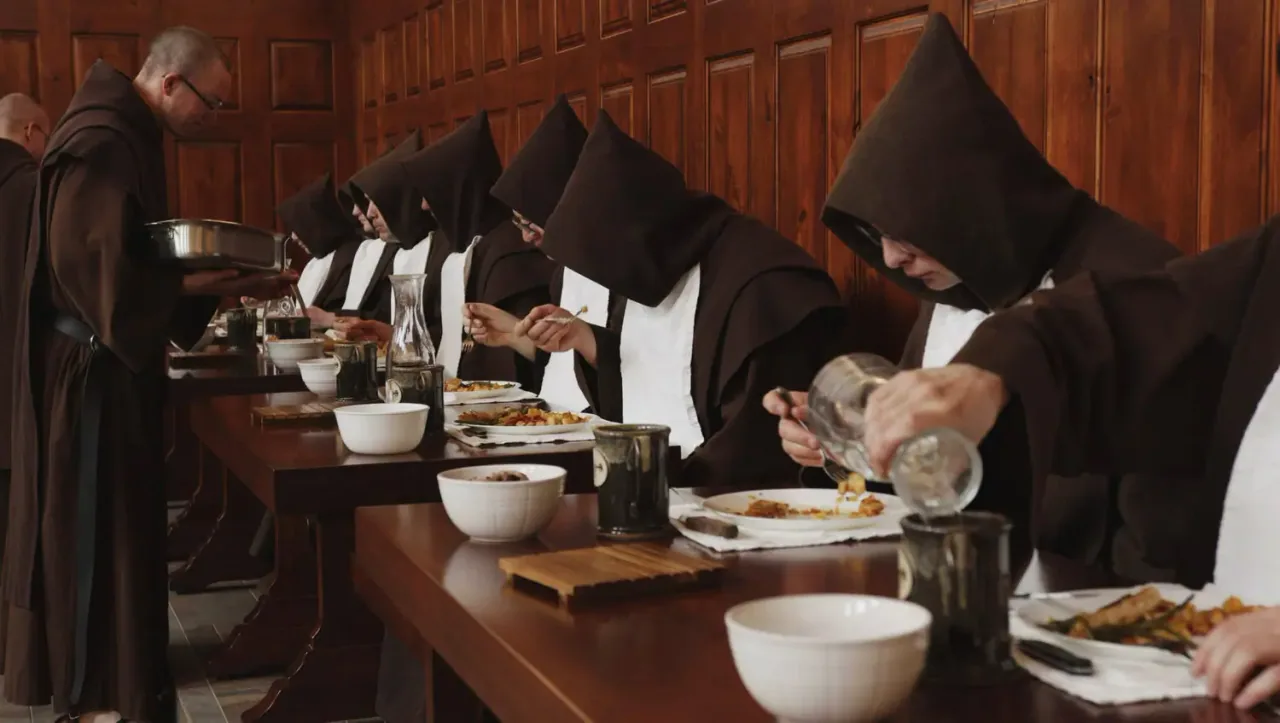 The monks at a meal in the refectory