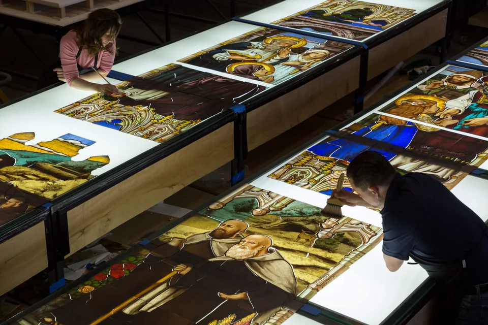 Artists at Judson Studios painting the glass of Mary’s Presentation in the Temple