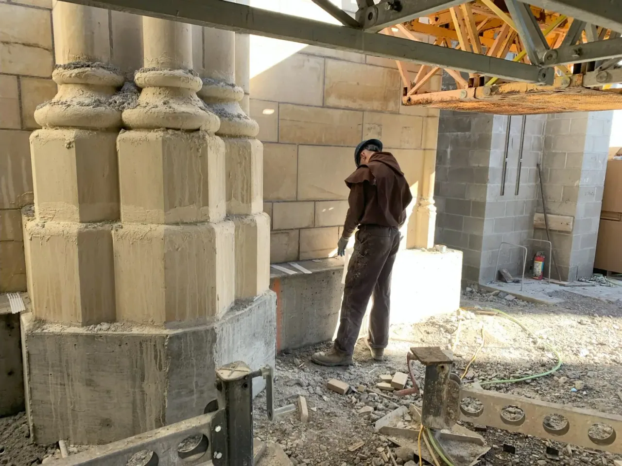 A monk at work among the Chapel’s stone columns