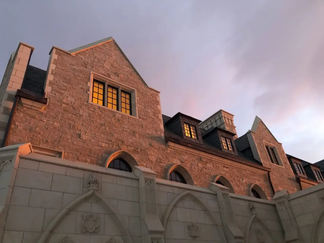 The stone and brick of the monastery buildings at dusk